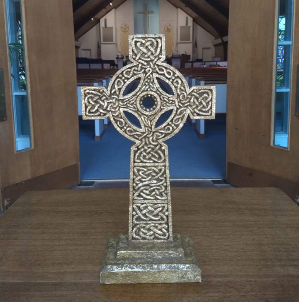 Cross with sanctuary in background