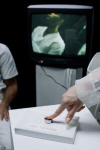 person pressing a button