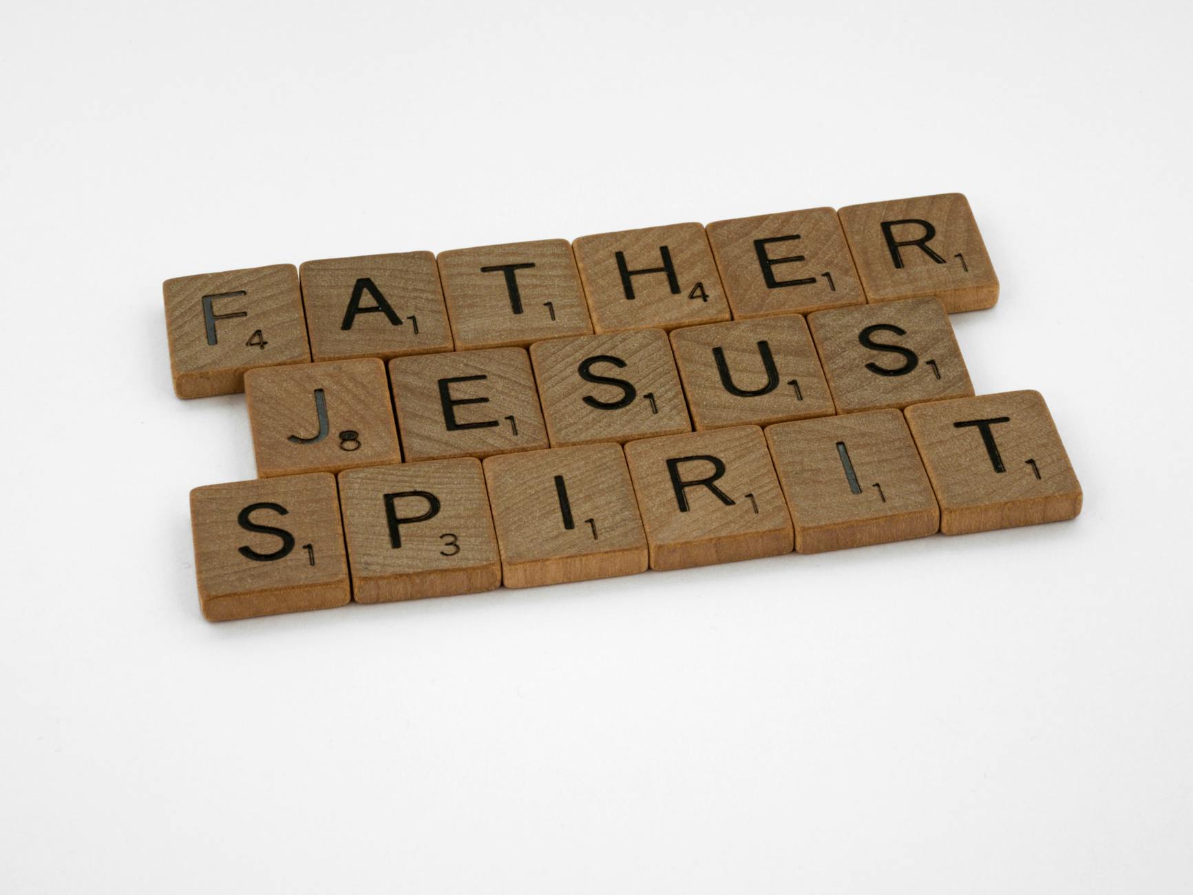 wooden scrabble tiles on white background