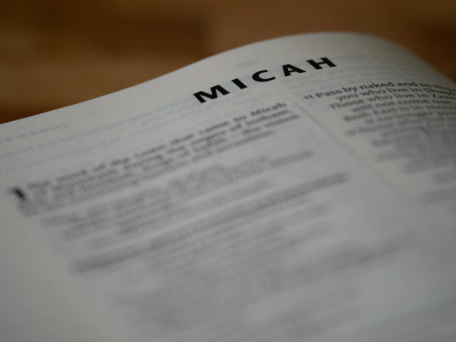 a close up of a bible with the word micah written on it