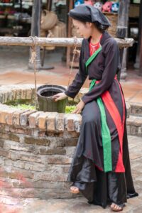 traditional woman at historic stone well