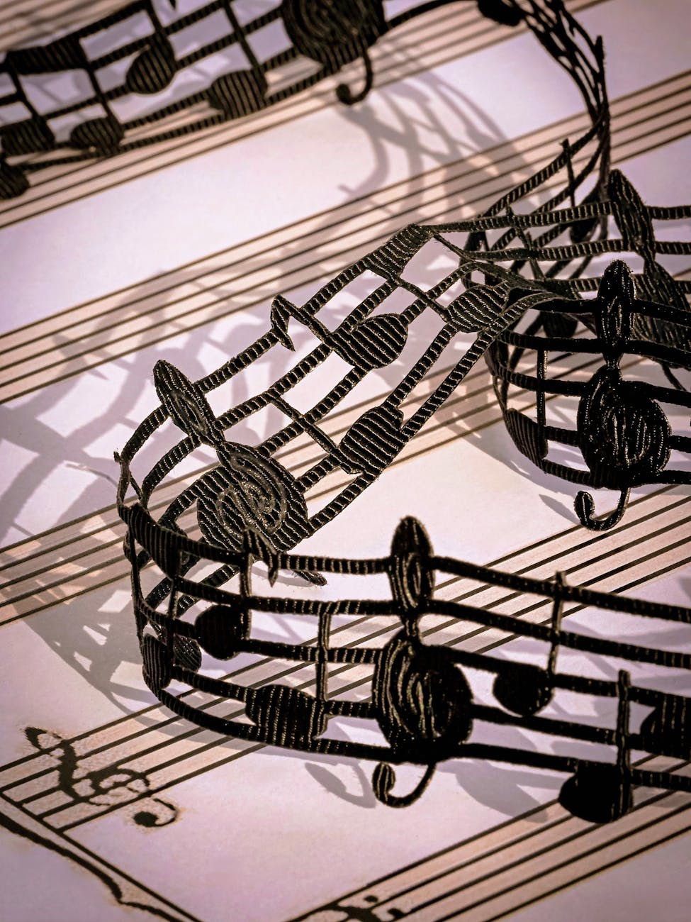 intricate black lace musical notes on sheet music