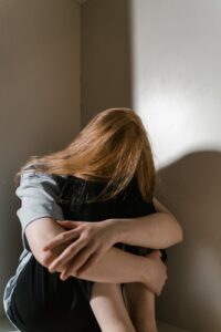 a lonely woman sitting by herself