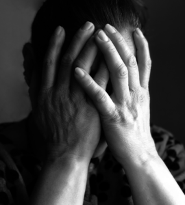 extreme close up of a woman covering her face
